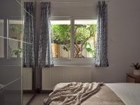 Postel nebo postele na pokoji v ubytování Margie City Apartment