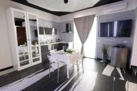 Kuchyňa alebo kuchynka v ubytovaní Garda fantasy green jacuzzi sauna piscina