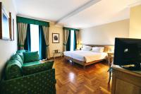 Posteľ alebo postele v izbe v ubytovaní Ambassador Palace Hotel