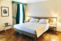 Posteľ alebo postele v izbe v ubytovaní Ambassador Palace Hotel