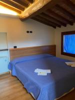 Posteľ alebo postele v izbe v ubytovaní Agriturismo La Sorgente di Rossi Valentino