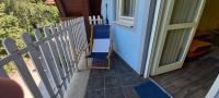 a blue and white fence next to a door at AMRI Apartman in Balatonföldvár