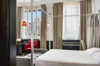 Palazzo Firenze by Baglioni Hotels & Resortsにあるベッド