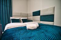 Posteľ alebo postele v izbe v ubytovaní Apartament Emi Zator by Housine