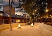 a courtyard with two lights in front of a building at Jangal das Araucárias Swan Design Hotel Canela in Canela