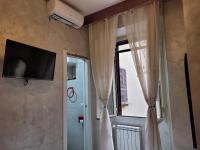 Televízia a/alebo spoločenská miestnosť v ubytovaní Captin Home Roma