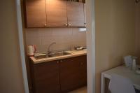 Kuchyň nebo kuchyňský kout v ubytování Helenas Apartment