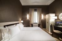 Łóżko lub łóżka w pokoju w obiekcie San Giuliano Inn