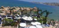 an aerial view of a beach with chairs and umbrellas at Lamedina Hotel &amp; Resort in Jounieh