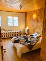 Łóżko lub łóżka w pokoju w obiekcie Valberg 8 couchages cocon familial