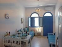 Postel nebo postele na pokoji v ubytování Amphitrite's Haven - Cycladic House in Marpissa, Paros