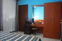 A bed or beds in a room at Hotel Alessander