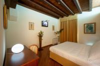 Posteľ alebo postele v izbe v ubytovaní Hotel Flora