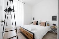 Łóżko lub łóżka w pokoju w obiekcie Le Concorde 3 - Appartement 2 chambres - 8 pers - Terrasse - Clim