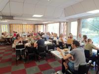 a group of people sitting at tables in a restaurant at Astrotel Romorantin-Lanthenay Soirée étape in Romorantin