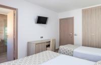 Posteľ alebo postele v izbe v ubytovaní Hotel Olympia Ronda II
