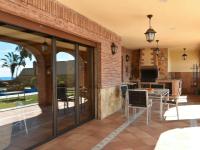 Televízia a/alebo spoločenská miestnosť v ubytovaní Holiday Home El balcón de la cala by Interhome