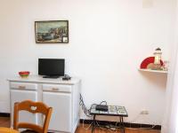 Televízia a/alebo spoločenská miestnosť v ubytovaní Apartment Les Cigales by Interhome