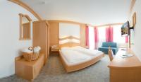 Łóżko lub łóżka w pokoju w obiekcie Hotel zum grünen Tor