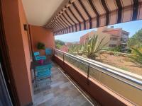 a balcony with a table and a view at appartement vue mer avec place de parking privée in Sainte-Maxime