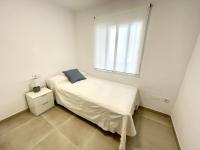 A bed or beds in a room at Piso en el Puerto de Dénia con balcón