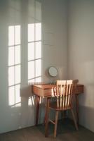 a wooden desk with a mirror and a chair at Bethlehem B&amp;B Kenting in Eluan