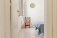 A bed or beds in a room at Los Delfines Biniforcat