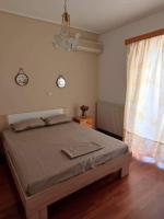 Posteľ alebo postele v izbe v ubytovaní Katerina 's Penthouse