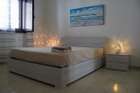 Posteľ alebo postele v izbe v ubytovaní Giu Al Mar - Apartment