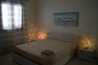 Posteľ alebo postele v izbe v ubytovaní Giu Al Mar - Apartment