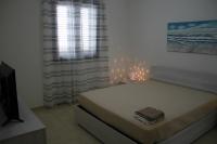 Posteľ alebo postele v izbe v ubytovaní Giu Al Mar - Apartment