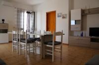 Televízia a/alebo spoločenská miestnosť v ubytovaní Giu Al Mar - Apartment