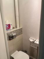 a small bathroom with a toilet and a sink at Chambre d hote au calme in Brétigny-sur-Orge
