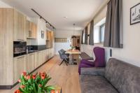 Kuchyňa alebo kuchynka v ubytovaní Emma Deluxe Aparthotel ganzjährig beheizter Außenpool