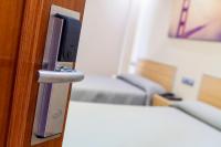Posteľ alebo postele v izbe v ubytovaní Hotel Olympia Ronda I