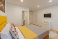 Villa Apartments & Suitesにあるテレビまたはエンターテインメントセンター