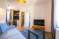 Telewizja i/lub zestaw kina domowego w obiekcie Le Bois, T2 hypercentre chic et cosy, Wifi par SOVALFI