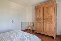 Łóżko lub łóżka w pokoju w obiekcie Maison en front de mer- 10 Personnes - Jardin