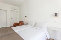 Postel nebo postele na pokoji v ubytování Lisbon Old Town Guest House