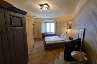 A bed or beds in a room at Gasthof Hotel Zweimüller