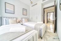 Postel nebo postele na pokoji v ubytování Cheerful 3BR Townhouse at DAMAC Hills 2, Dubailand by Deluxe Holiday Homes