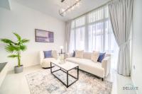 Posezení v ubytování Cheerful 3BR Townhouse at DAMAC Hills 2, Dubailand by Deluxe Holiday Homes
