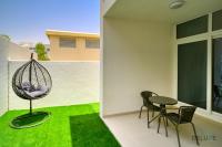 Patio nebo venkovní prostory v ubytování Cheerful 3BR Townhouse at DAMAC Hills 2, Dubailand by Deluxe Holiday Homes
