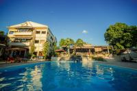 a swimming pool in front of a hotel at AUX ROCHES ROUGES in Mahajanga