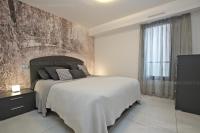 a bedroom with a large bed and a large window at 7 Croisette 7C201 in Cannes