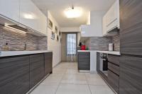a kitchen with white and brown cabinets and appliances at 7 Croisette 7C201 in Cannes
