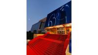 a red escalator in front of a building at 7 Croisette 7C201 in Cannes