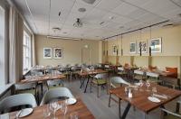 a dining room with wooden tables and chairs at Hotel Klaustur in Kirkjubæjarklaustur