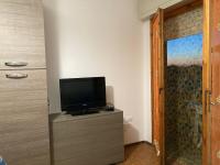 Televízia a/alebo spoločenská miestnosť v ubytovaní Casa Selia