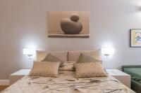 Posteľ alebo postele v izbe v ubytovaní Firenze Rentals Deluxe Corso 5